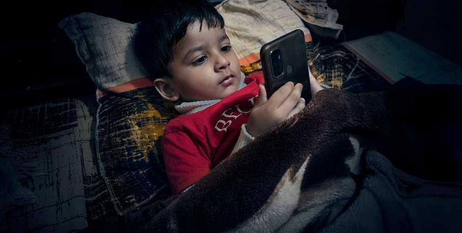 sleeping baby with phone